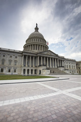 Fototapeta na wymiar United States Capitol Building in Washington DC with American 