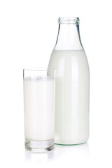 Opened bottle and glass with milk