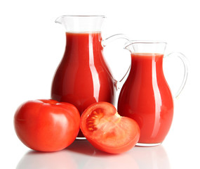 Tomato juice in pitchers isolated on white