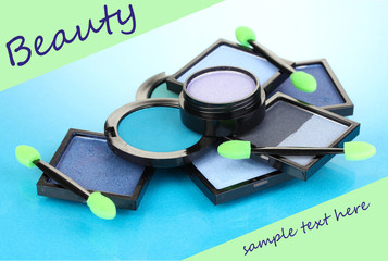 Bright eye shadows and sponge brushes for foundation