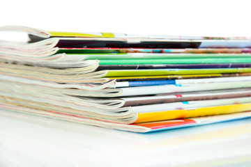 Many magazines isolated on white