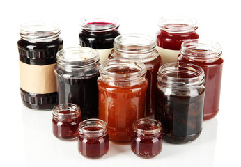 Tasty jam in banks isolated on white