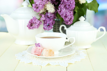 Obraz na płótnie Canvas Composition with beautiful lilac flowers, tea service