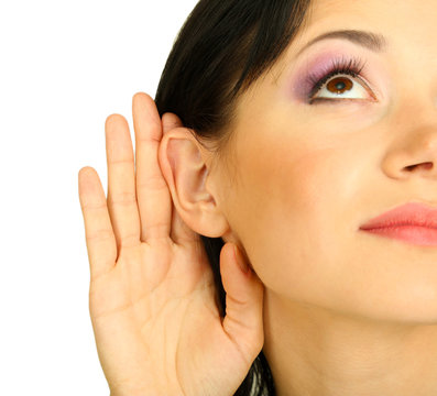Girl overhears on grey background
