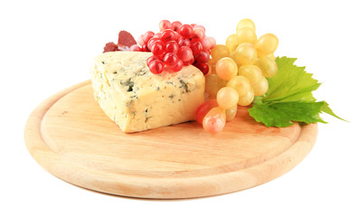 Tasty blue cheese and grape on cutting board, isolated on white