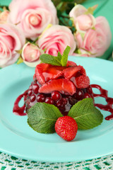 Tasty jelly dessert with fresh berries, on bright background