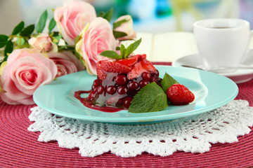 Fototapeta na wymiar Tasty jelly dessert with fresh berries, on bright background