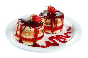 Tasty biscuit cakes with jam and berries