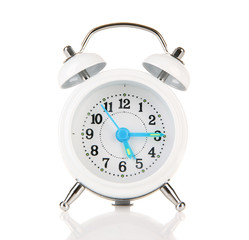 Old style alarm clock isolated on white