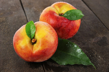Peaches on wooden table