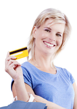 Credit cards and shopping bags holding the hand of a woman.