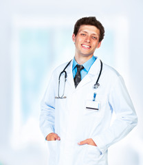 Portrait of the smiling doctor in interior