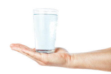 A glass of clean and fresh water in the hand of man. On a white