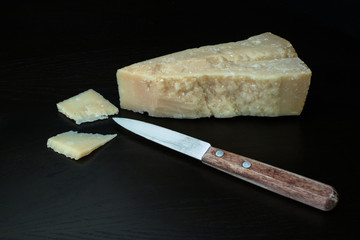 italian parmesan cheese with knife