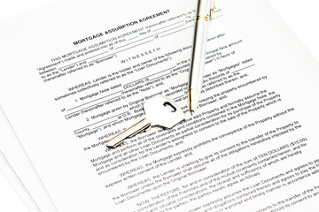 Fototapeta premium Mortgage assumption agreement with a pen for signature and a key