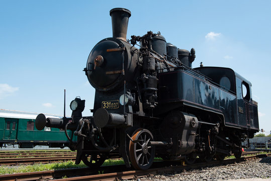 Vintage steam locomotive in station