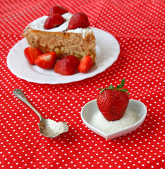 Spoon and delicious strawberry with sugar