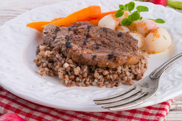 grill chop, buckwheat groats and roasted radishes