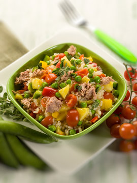 cold rice salad with tuna and pineapple, selective focus