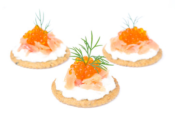 crackers with cream cheese, salted salmon, red caviar