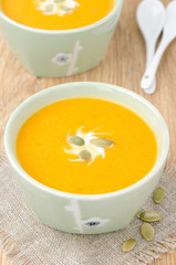 bowl of pumpkin soup with ginger, top view