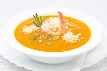pumpkin soup with shrimp, Parmesan and rosemary horizontal