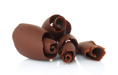 Chocolate shavings on white background .