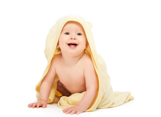 happy beautiful baby in yellow towel isolated