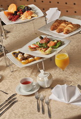 Table full of various tasty and fresh food for banquet at hotel