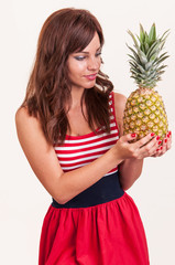 Happy woman with fresh pineapple fruit