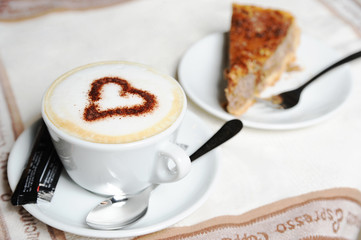Cup of a cappuccino and pie
