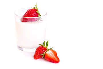 Fresh yougurt in a glass with strawberry isolated on white