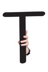 Hand breaking paper surface holding letter 'T'