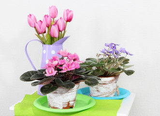 Fototapeta na wymiar Decorative elements and flowers on table
