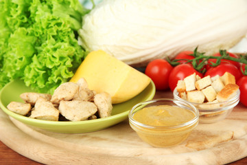 Ingredients for Caesar salad on bright background