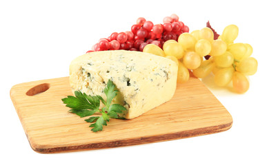 Tasty blue cheese and grape on cutting board, isolated on white