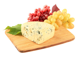Tasty blue cheese and grape on cutting board, isolated on white