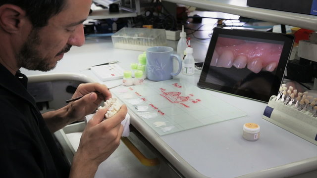 Dental technician working on prosthesis