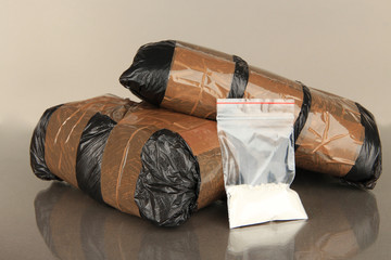 Packages of  narcotics on gray background