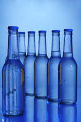 Water bottles on blue background