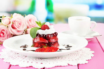 Tasty jelly dessert with fresh berries, on bright background