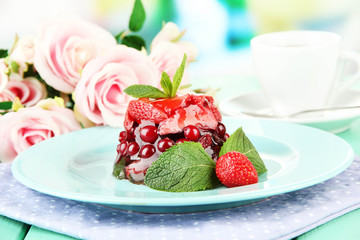 Tasty jelly dessert with fresh berries, on bright background