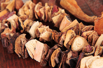 Dried mushrooms on wooden background