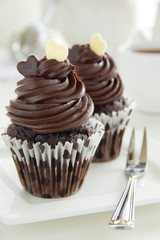 Chocolate muffins with chocolate cream.