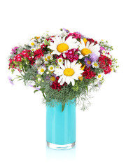 Beautiful bright flowers in vase isolated on white