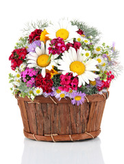 Fototapeta na wymiar Beautiful bright flowers in wooden basket isolated on white
