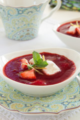 Dessert. Strawberry soup with cream.