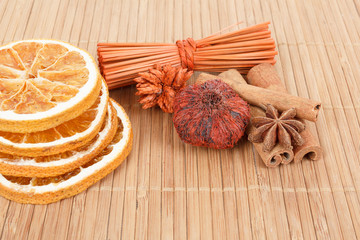 Star Anise, cinnamon and dried orange wooden background