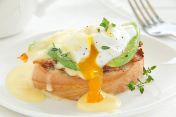 Breakfast. Poached egg with hollandaise sauce,