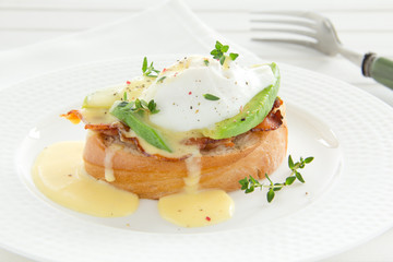 Breakfast. Poached egg with hollandaise sauce,